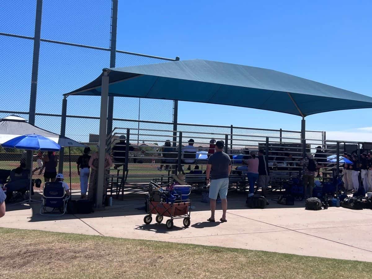 baseball dad with wagon at summer baseball tournament